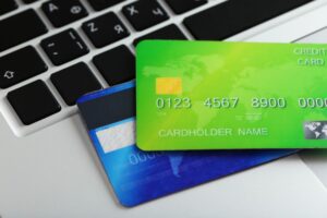 credit cards on top of a mac keyboard