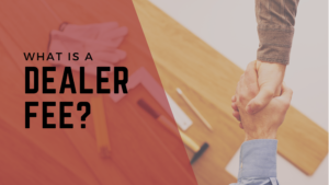 The words "What Is a Dealer Fee?" over an image of two people shaking hands.